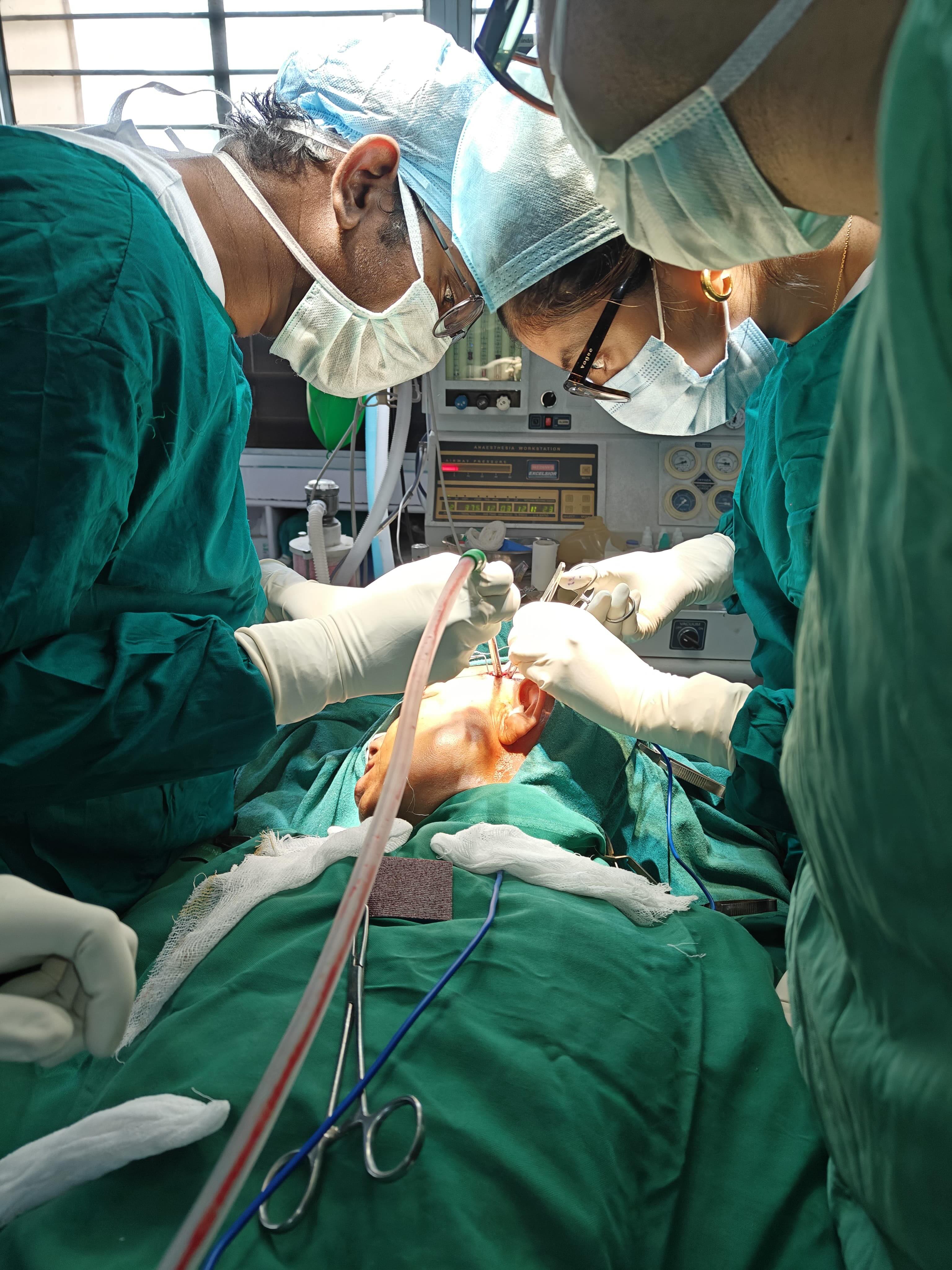 Maxillofacial surgical procedure in progress under sterile OT illumination